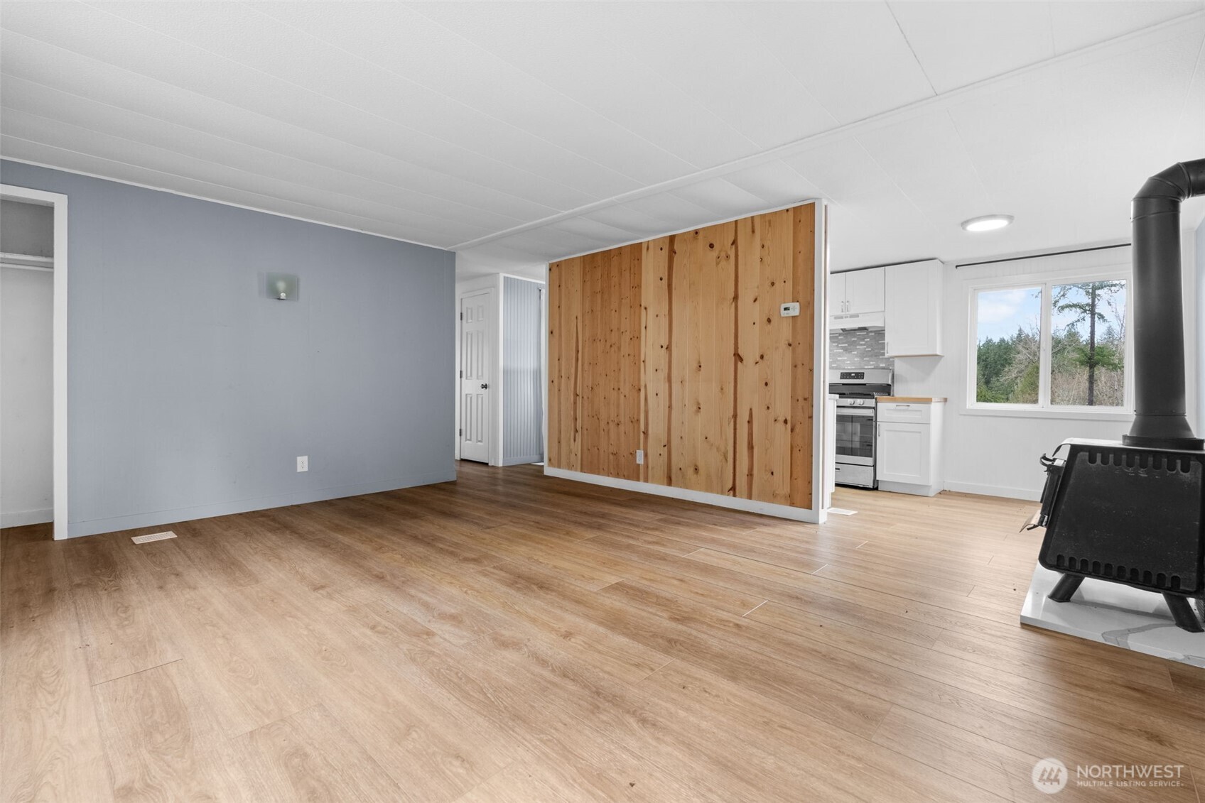 18818 Slough Lane Southeast Yelm, WA 98597 - Photo 7 of 39 a view of a livingroom with furniture and wooden floor