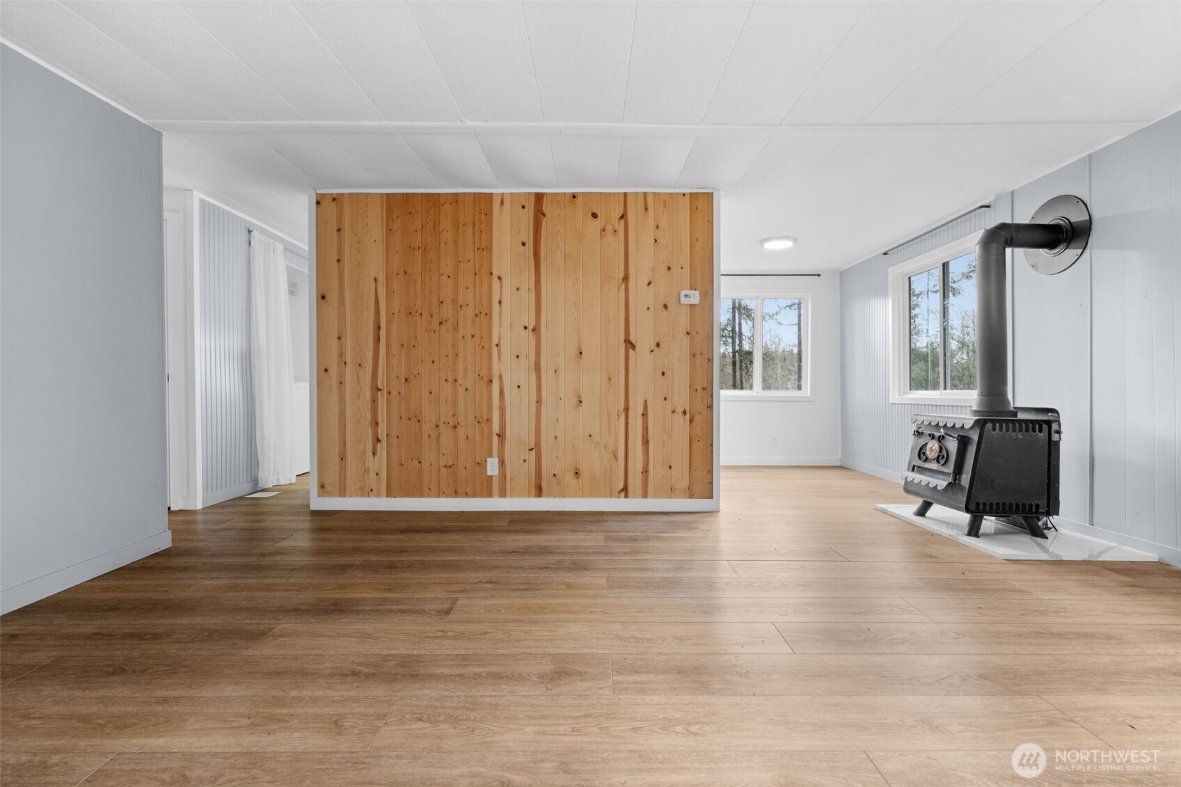 18818 Slough Lane Southeast Yelm, WA 98597 - Photo 8 of 39 a view of a livingroom with a flat screen tv