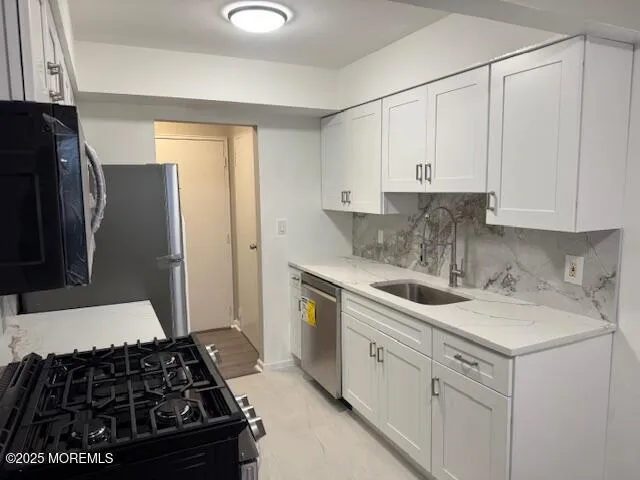 a kitchen with a stove and a refrigerator