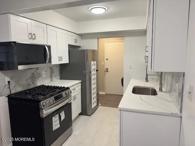 a kitchen with a stove and a refrigerator