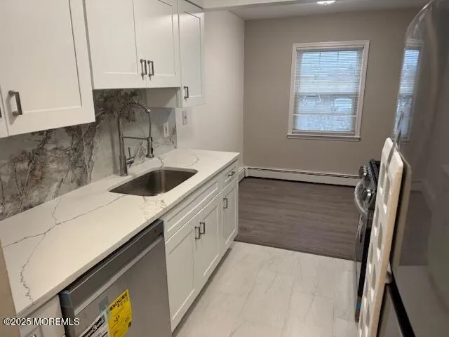 a kitchen with a sink cabinets and window