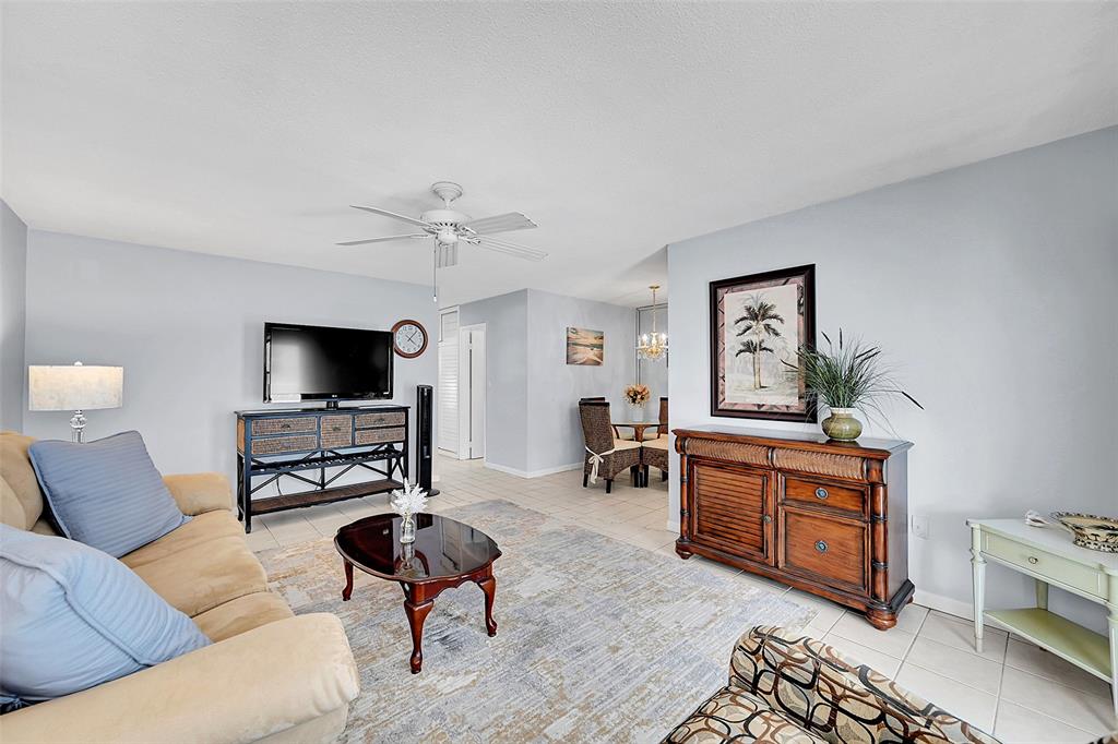 1110 North Riverside Drive, Unit 27 Pompano Beach, FL 33062 - Photo 24 of 52 Bright, Open, Spacious and Ready for You and Your Family and Friends to Enjoy! Your Furnished Living Room includes a Queen Sized Sofa Bed, Impact Windows and Doors with Blinds and Retractable Screen Doors!
