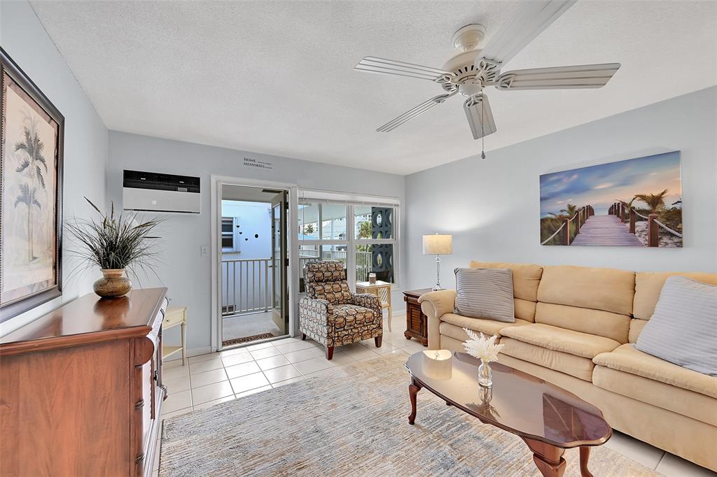 1110 North Riverside Drive, Unit 27 Pompano Beach, FL 33062 - Photo 26 of 52 Retractable Screen Doors Shown Here are included in Your Living Room and Kitchen for a No Bug Zone. Can you feel the South Florida Breeze Already?