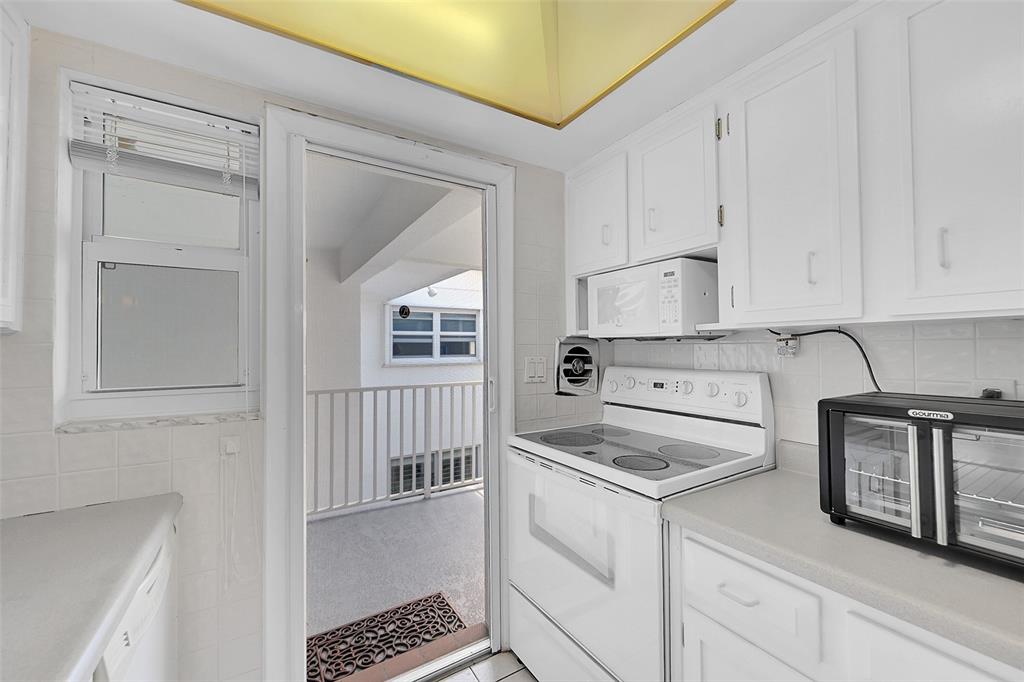 1110 North Riverside Drive, Unit 27 Pompano Beach, FL 33062 - Photo 30 of 52 Retractable Screen Doors Shown Here are included in Your Living Room and Kitchen for a No Bug Zone. Can you feel the South Florida Breeze Already?