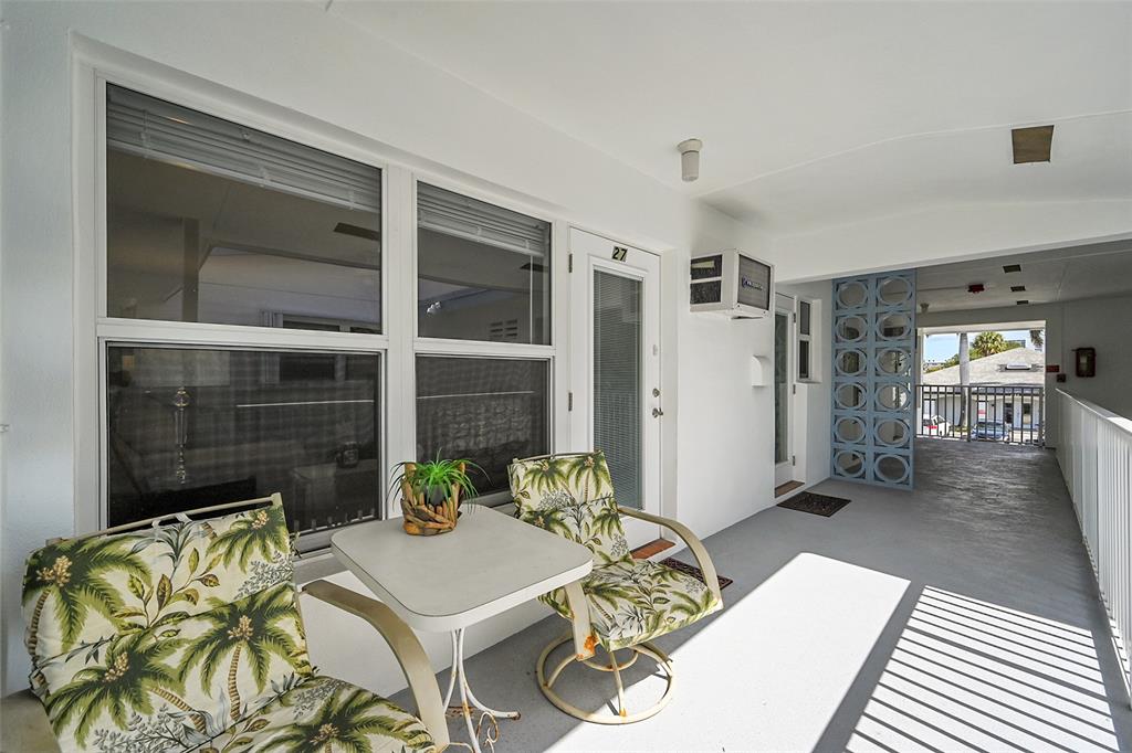 1110 North Riverside Drive, Unit 27 Pompano Beach, FL 33062 - Photo 4 of 52 This is Your Oversized Balcony Perfect for Relaxing or Entertaining! All Impact Windows & Both Doors also have Blinds & Retractable Screen Doors, Furnished & Ready for you to Enjoy the Fresh South Florida Air & Lifestyle!