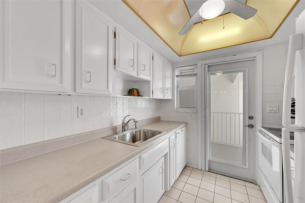 1110 North Riverside Drive, Unit 27 Pompano Beach, FL 33062 - Photo 6 of 52 Your Kitchen Features lots of Cabinet Space, is Bright & Has A Door to Your Balcony! Being Sold Furnished, Turn-Key. Impact Windows & Doors also include Blinds and Retractable Screen Doors!