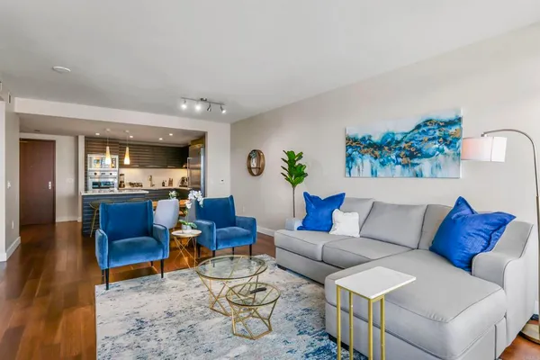 a living room with furniture and a large window