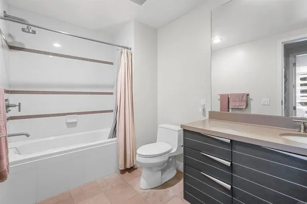 a bathroom with a sink a toilet and a bathtub