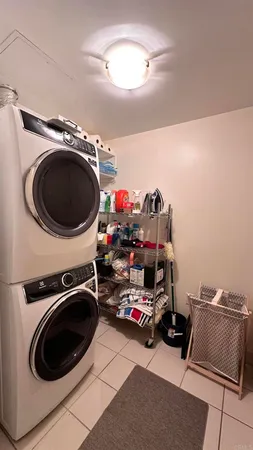 a utility room with sink dryer and washer