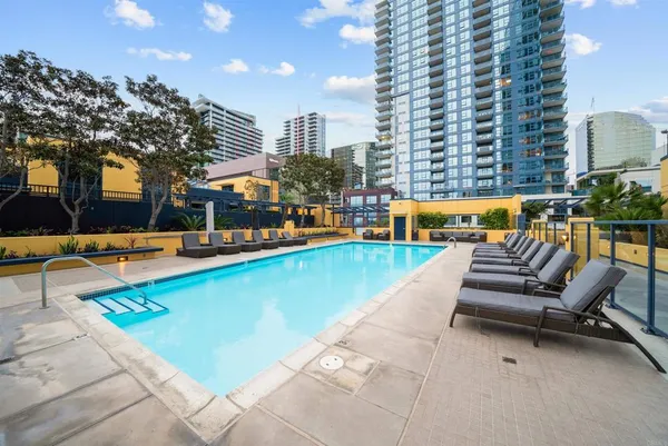 a view of swimming pool with chairs