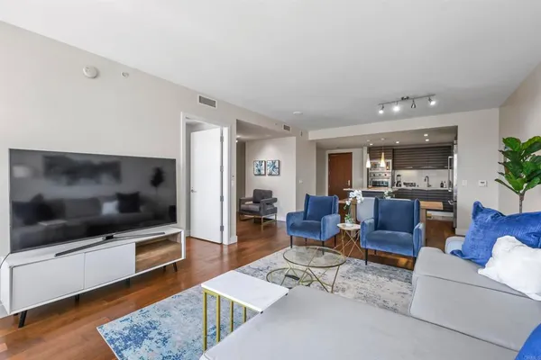 a living room with furniture and a flat screen tv