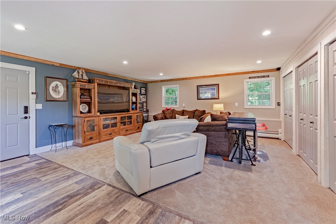8062 Chagrin Road Chagrin Falls, OH 44023 - Photo 27 of 50 Just off the laundry room, discover a surprise bonus room that is both spacious and versatile. Thoughtfully designed with a handy boot bench, and an entire wall of closets to keep things organized. This partially carpeted room is ideal to watch a movie, as a game night hub, or simply to unwind, the possibilities are endless.