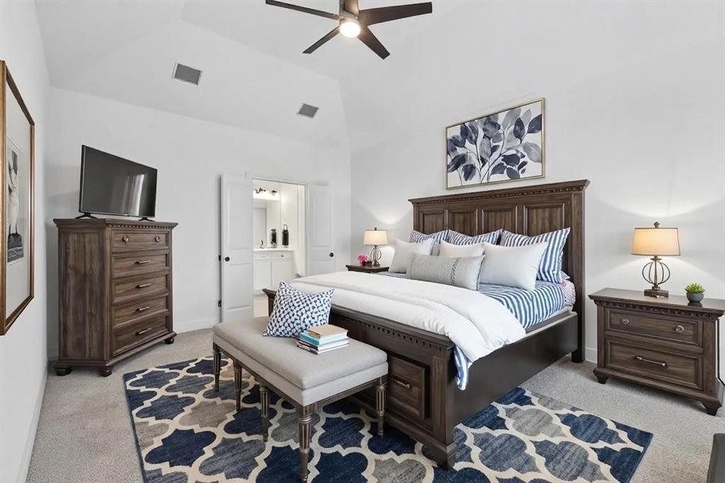 4933 Switchback Street Little Elm, TX 76227 - Photo 11 of 33 Primary bedroom is so spacious, plenty of room for a king size bed and overlooks the backyard with trees in view! This photo has some virtual staging.