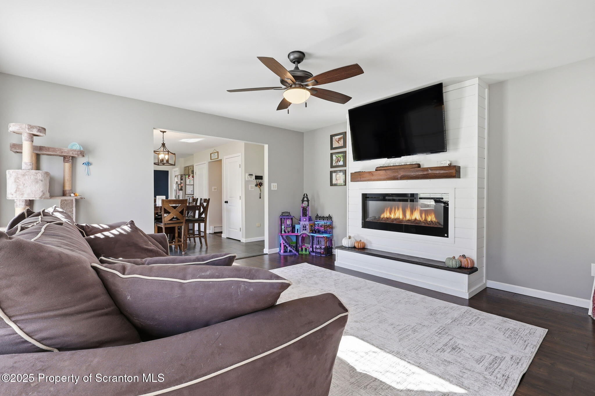 918 Jones Road Union Dale, PA 18470 - Photo 17 of 65 a living room with furniture a flat screen tv and a fireplace
