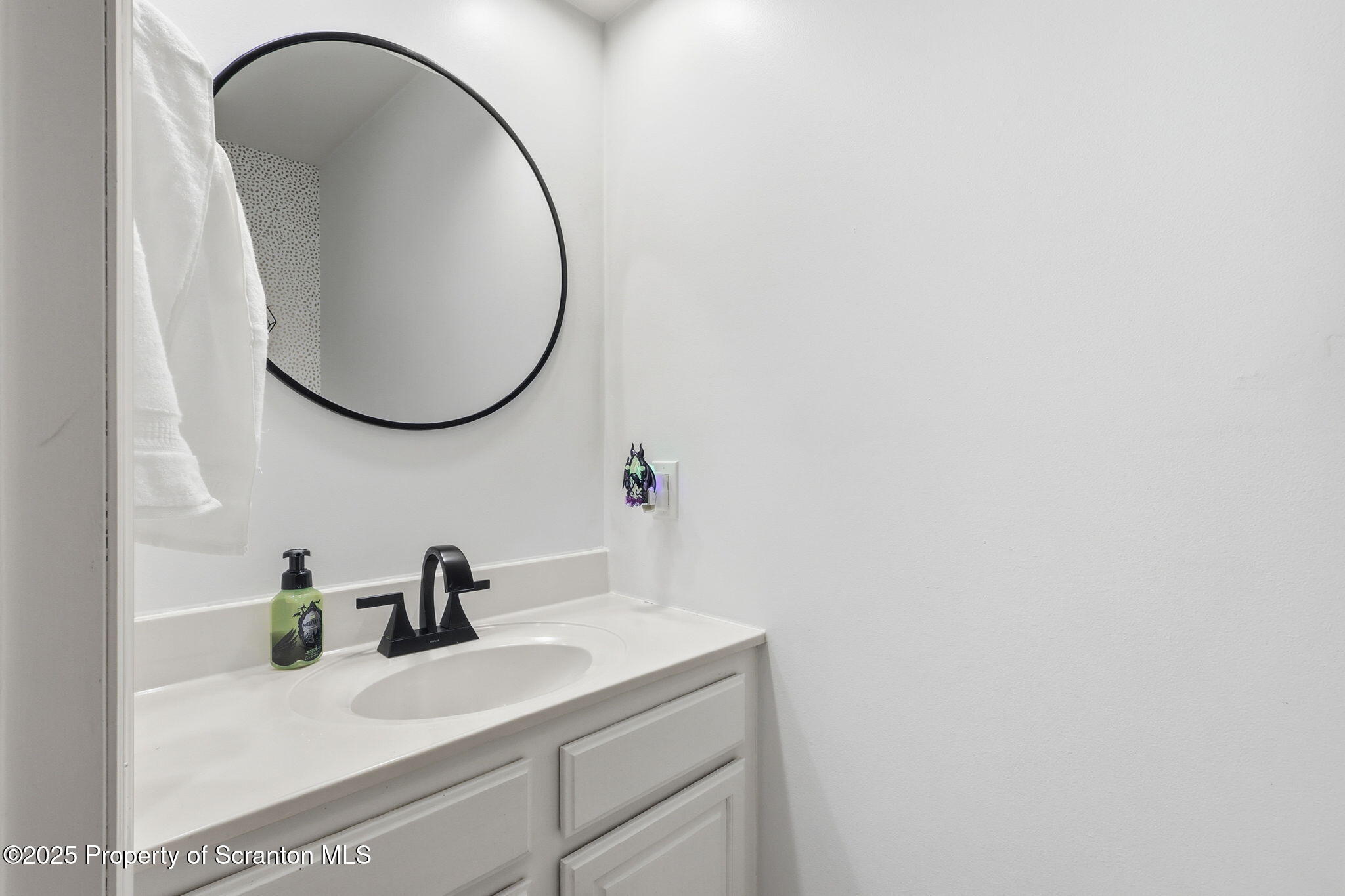 918 Jones Road Union Dale, PA 18470 - Photo 26 of 65 a bathroom with a sink and a mirror