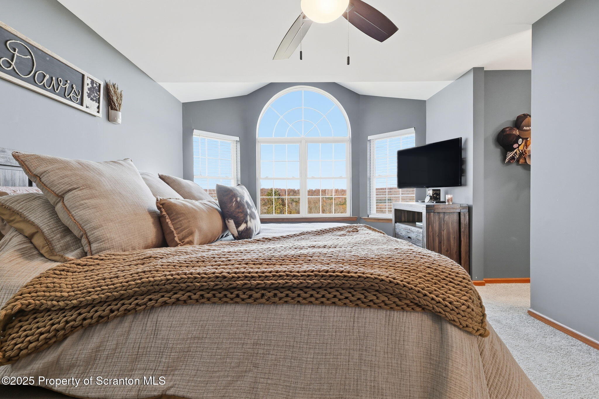 918 Jones Road Union Dale, PA 18470 - Photo 28 of 65 a bedroom with a large bed and a flat screen tv