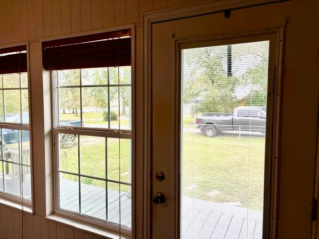 a view of an empty room with a window
