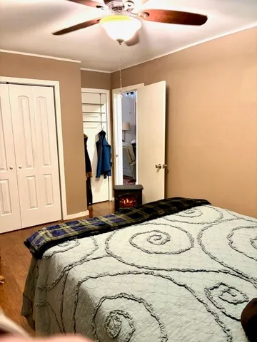 a bedroom with a bed and a window
