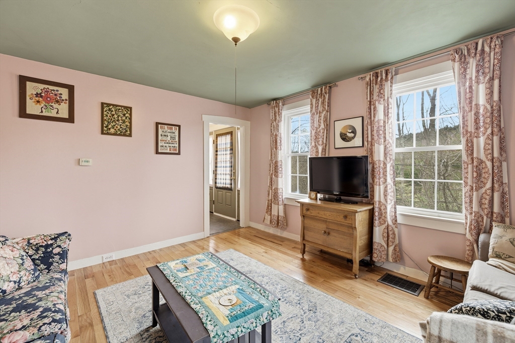 118 North Leverett Road Leverett, MA 01054 - Photo 5 of 26 a living room with furniture and a flat screen tv