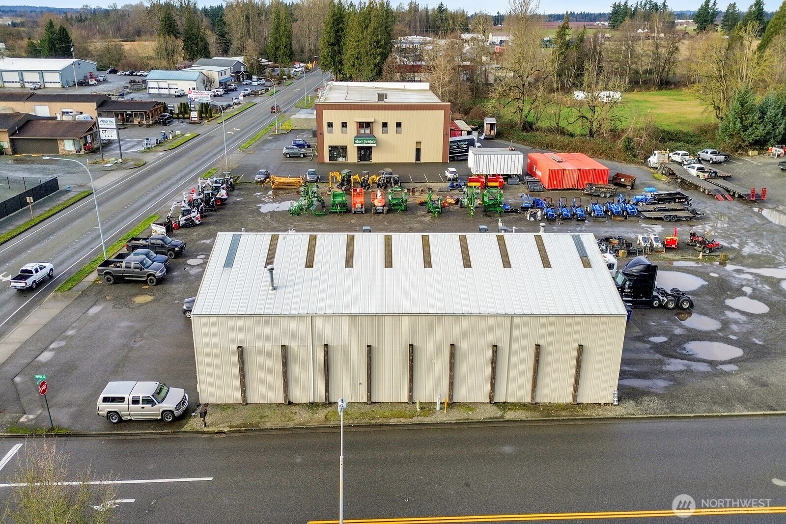 144 Birch Bay Lynden Road Lynden, WA 98264 - Photo 12 of 15 a view of a white building with many windows