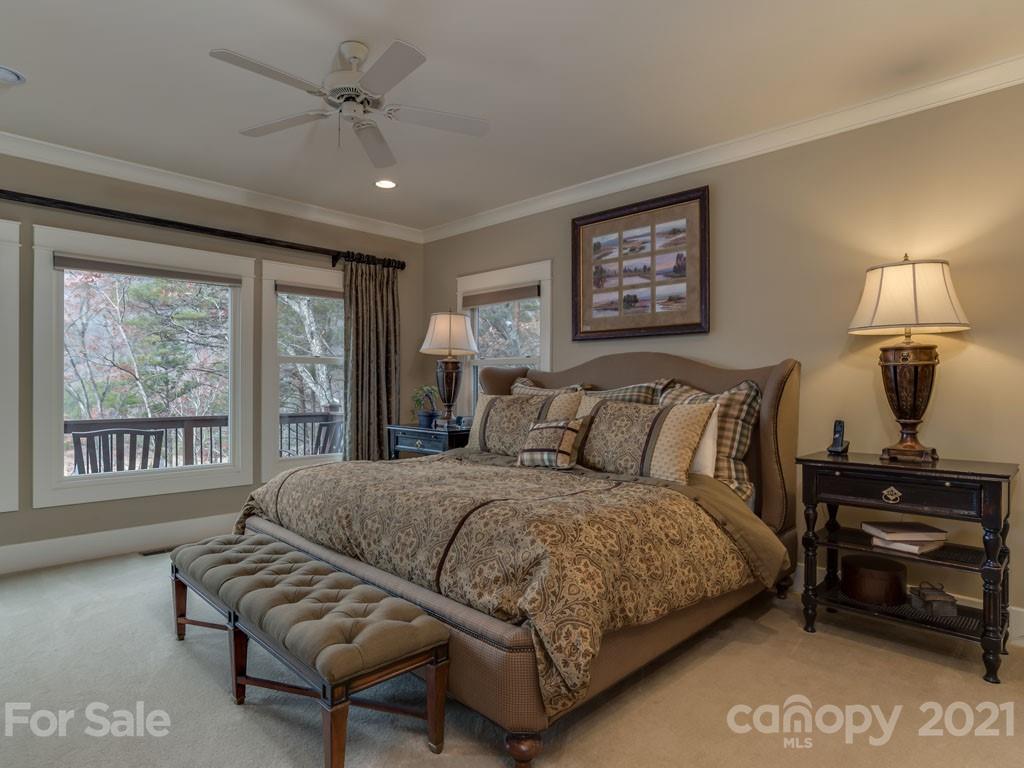 995 Deep Gap Farm Road East Mill Spring, NC 28756 - Photo 12 of 47 a bedroom with a bed furniture and a window