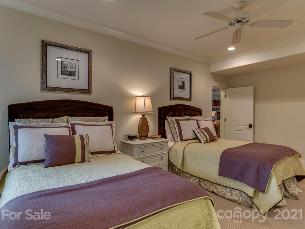 995 Deep Gap Farm Road East Mill Spring, NC 28756 - Photo 15 of 47 a bedroom with double bed and a cabinets