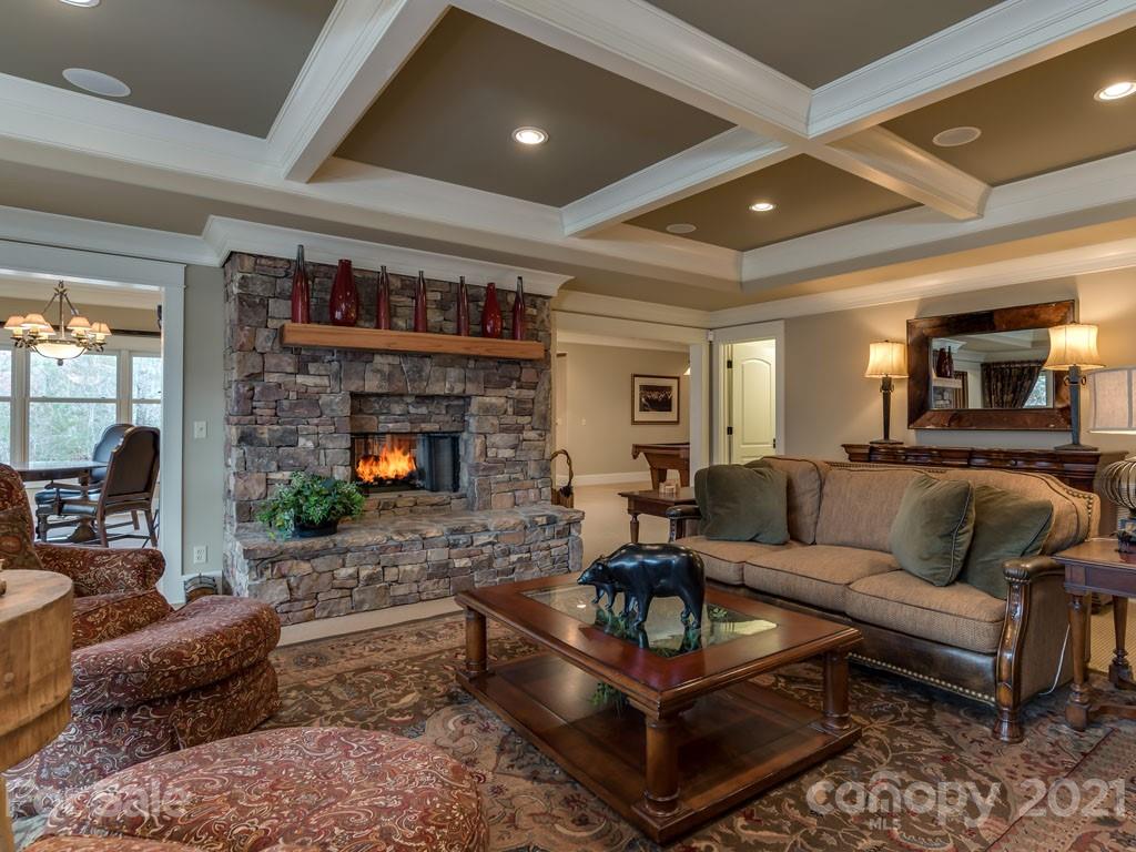 995 Deep Gap Farm Road East Mill Spring, NC 28756 - Photo 18 of 47 a living room with furniture a fireplace and a flat screen tv