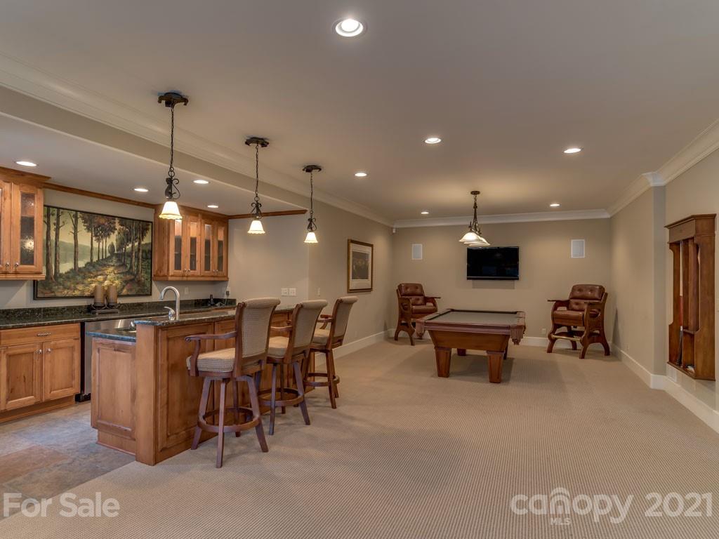 995 Deep Gap Farm Road East Mill Spring, NC 28756 - Photo 20 of 47 a large kitchen with a table and chairs