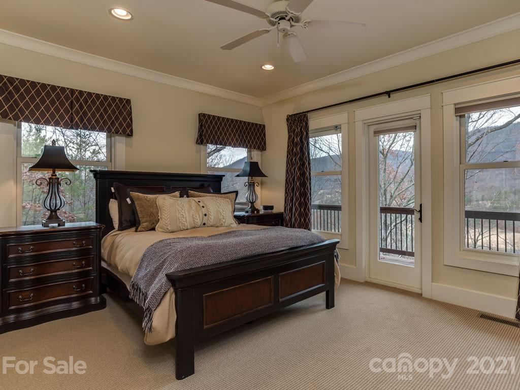 995 Deep Gap Farm Road East Mill Spring, NC 28756 - Photo 26 of 47 a bed sitting in a spacious bedroom next to a window