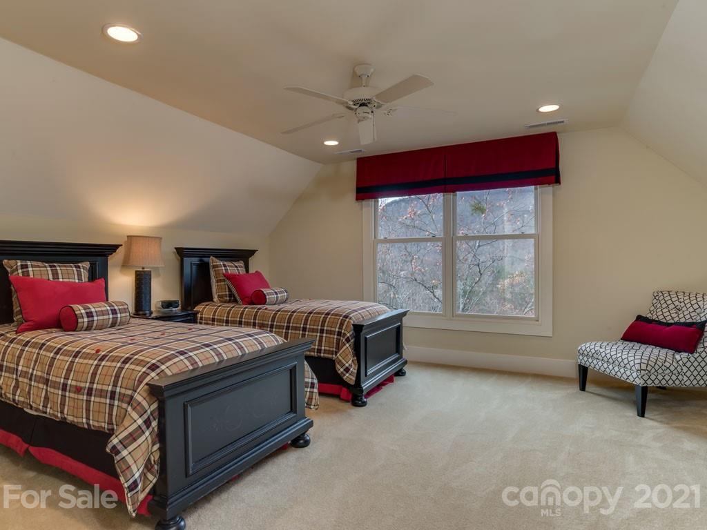 995 Deep Gap Farm Road East Mill Spring, NC 28756 - Photo 30 of 47 a bedroom with a bed and a window