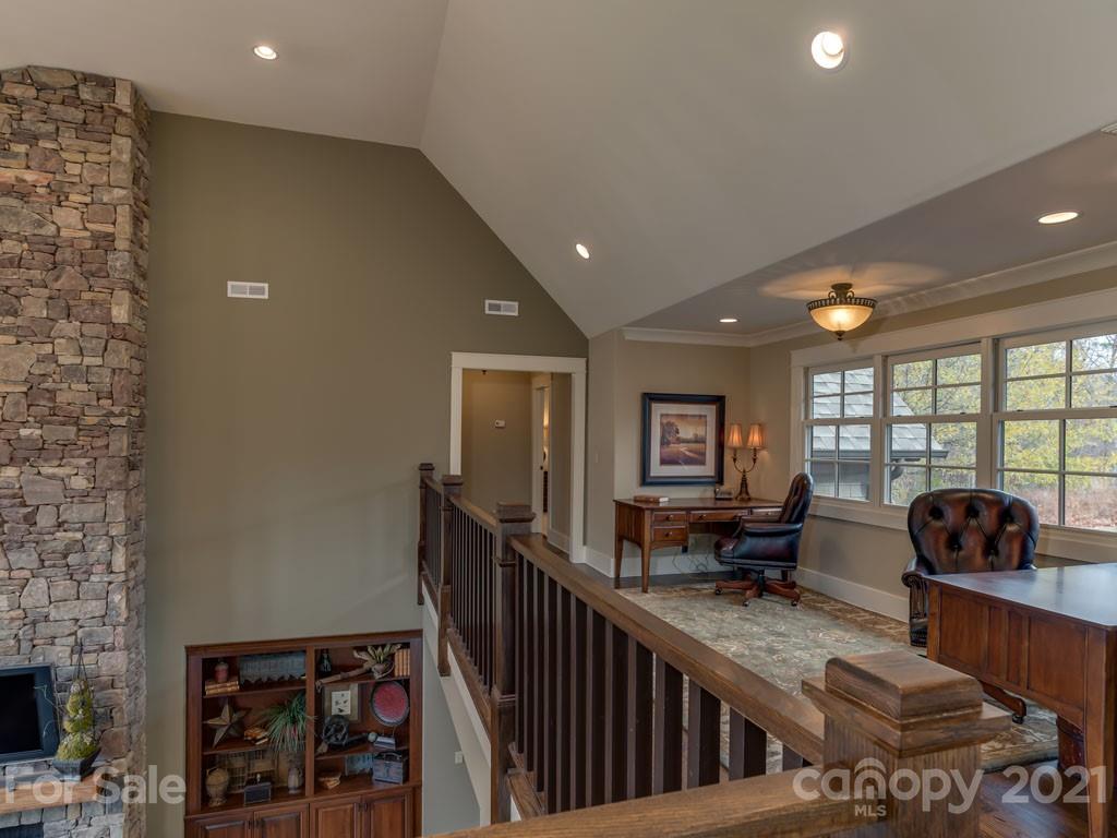 995 Deep Gap Farm Road East Mill Spring, NC 28756 - Photo 31 of 47 a living room with furniture and a flat screen tv