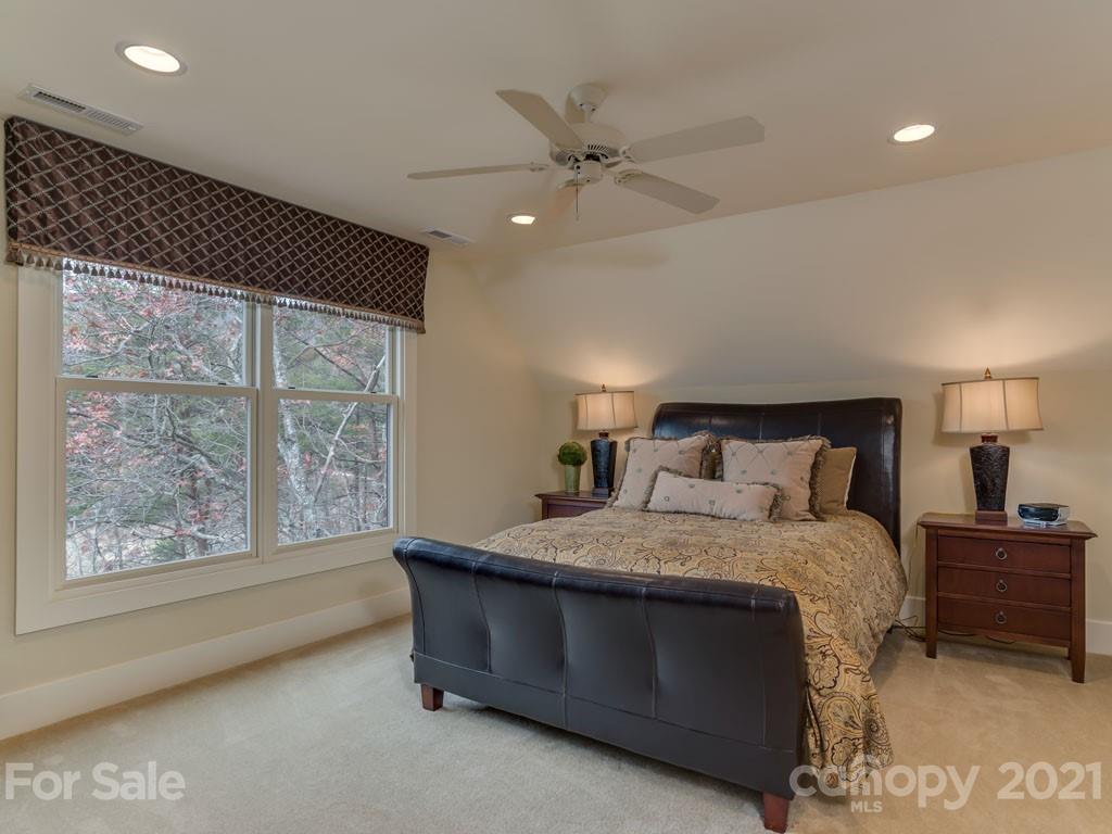 995 Deep Gap Farm Road East Mill Spring, NC 28756 - Photo 32 of 47 a bedroom with a bed and window