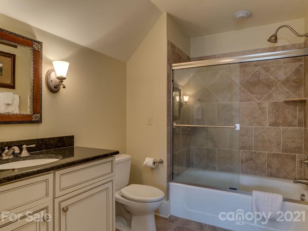 995 Deep Gap Farm Road East Mill Spring, NC 28756 - Photo 33 of 47 a bathroom with a shower and a toilet sink