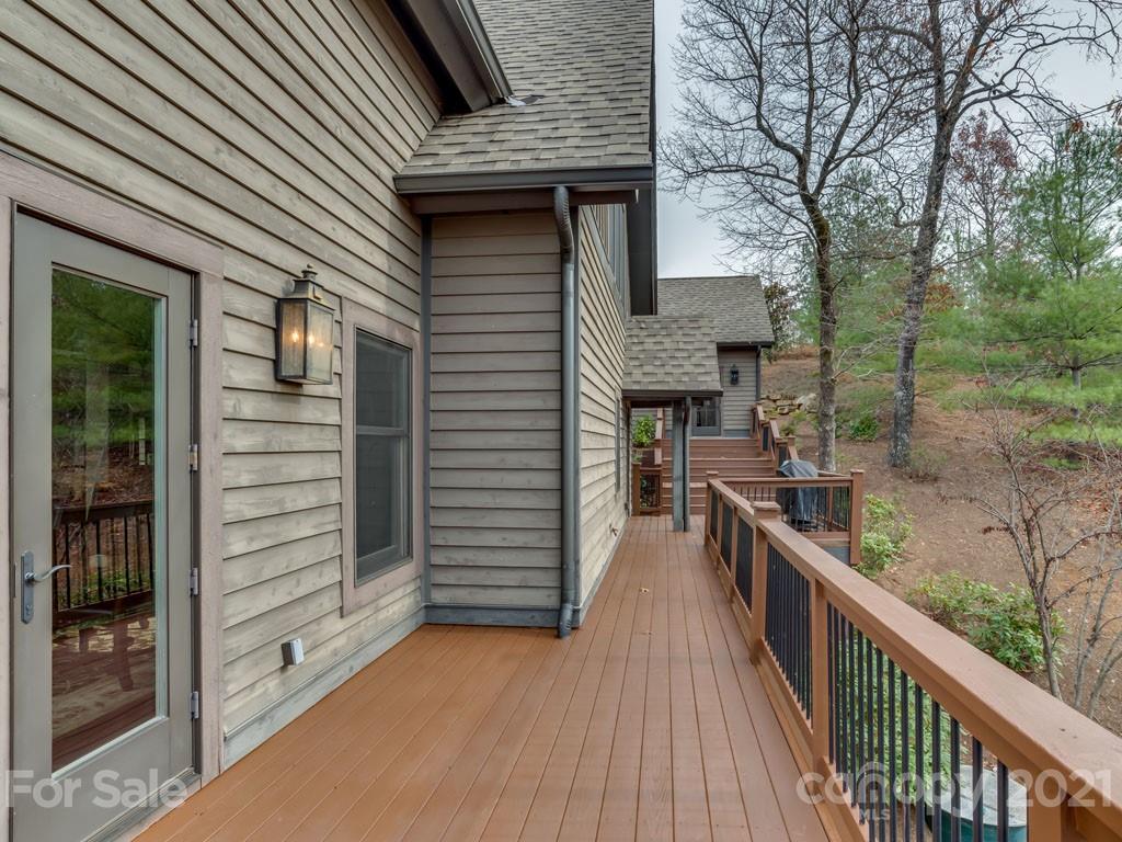 995 Deep Gap Farm Road East Mill Spring, NC 28756 - Photo 41 of 47 a view of a house with backyard and deck
