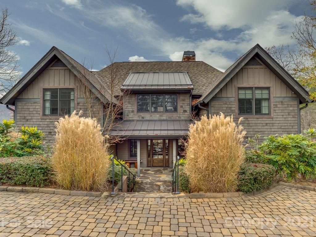 995 Deep Gap Farm Road East Mill Spring, NC 28756 - Photo 45 of 47 a front view of a house with a garden