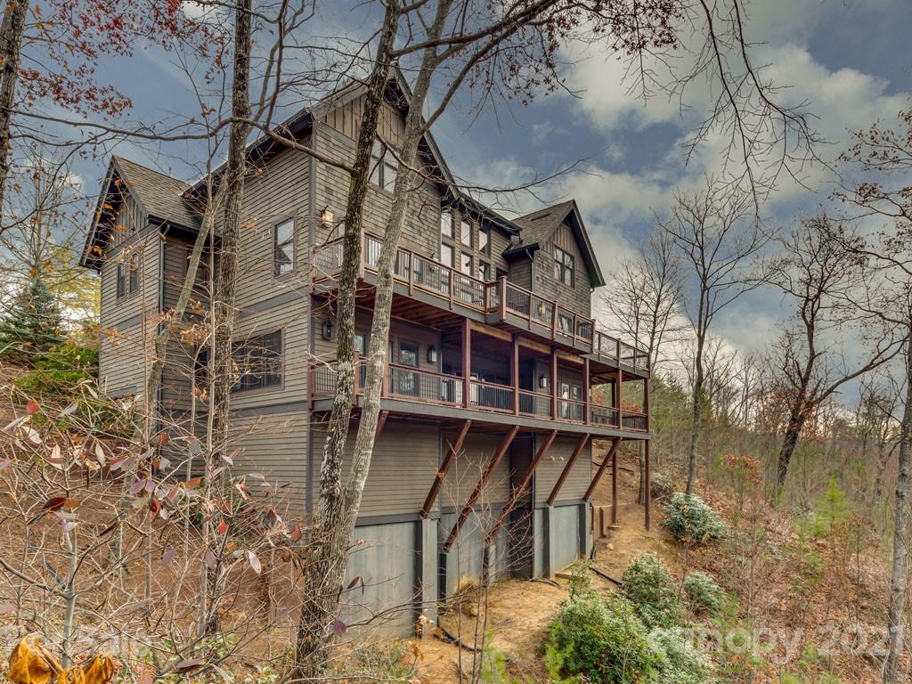 995 Deep Gap Farm Road East Mill Spring, NC 28756 - Photo 46 of 47 front view of a house with a yard