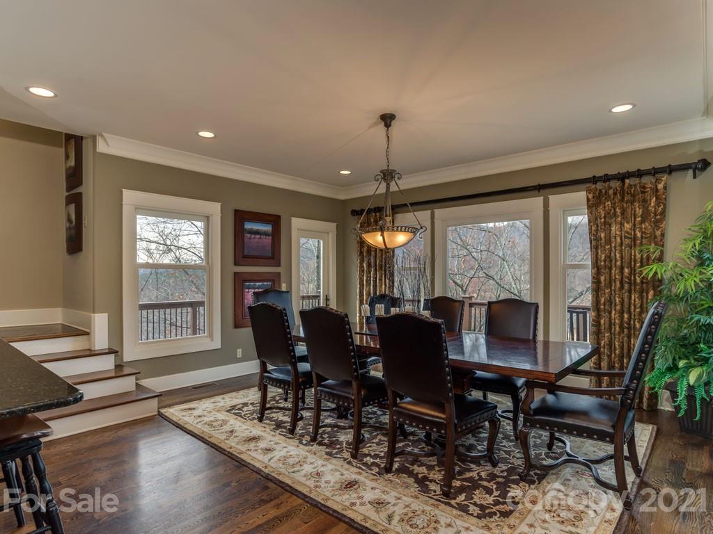 995 Deep Gap Farm Road East Mill Spring, NC 28756 - Photo 5 of 47 a view of a dining room with furniture window and wooden floor