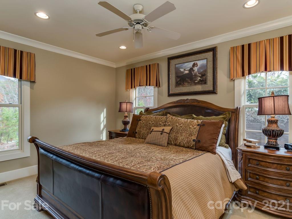 995 Deep Gap Farm Road East Mill Spring, NC 28756 - Photo 10 of 47 a bedroom with a large bed and a window