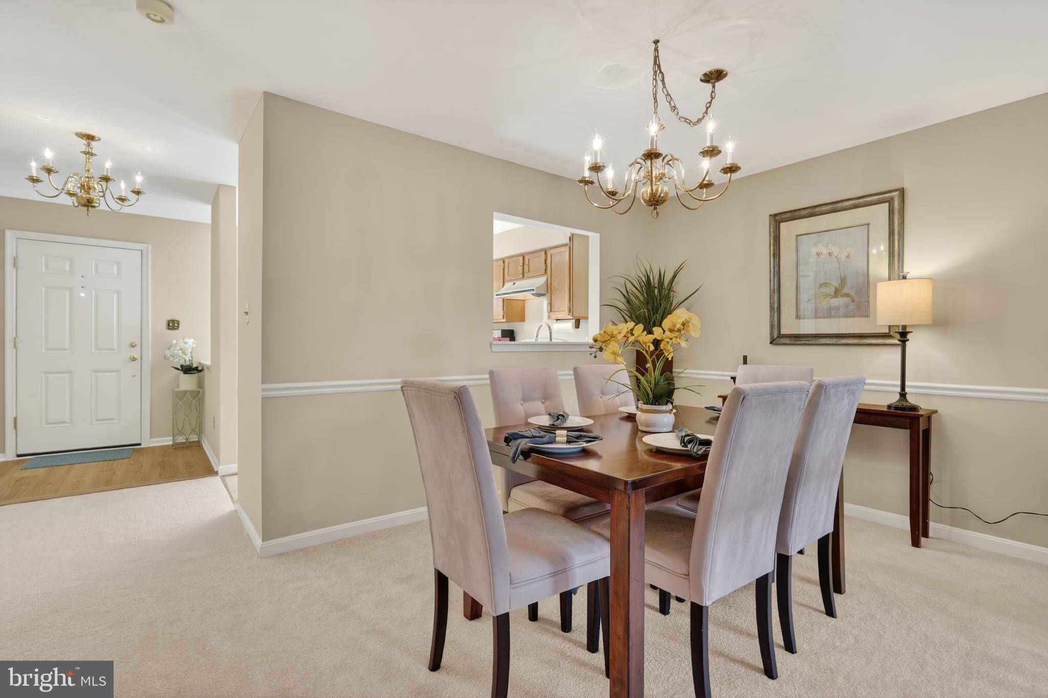 45590 Whitcomb Square Sterling, VA 20166 - Photo 11 of 43 a dining room with furniture and chandelier