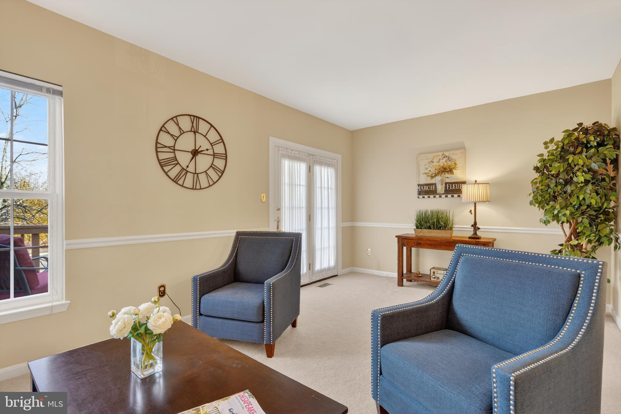 45590 Whitcomb Square Sterling, VA 20166 - Photo 12 of 43 a living room with furniture a clock and a window