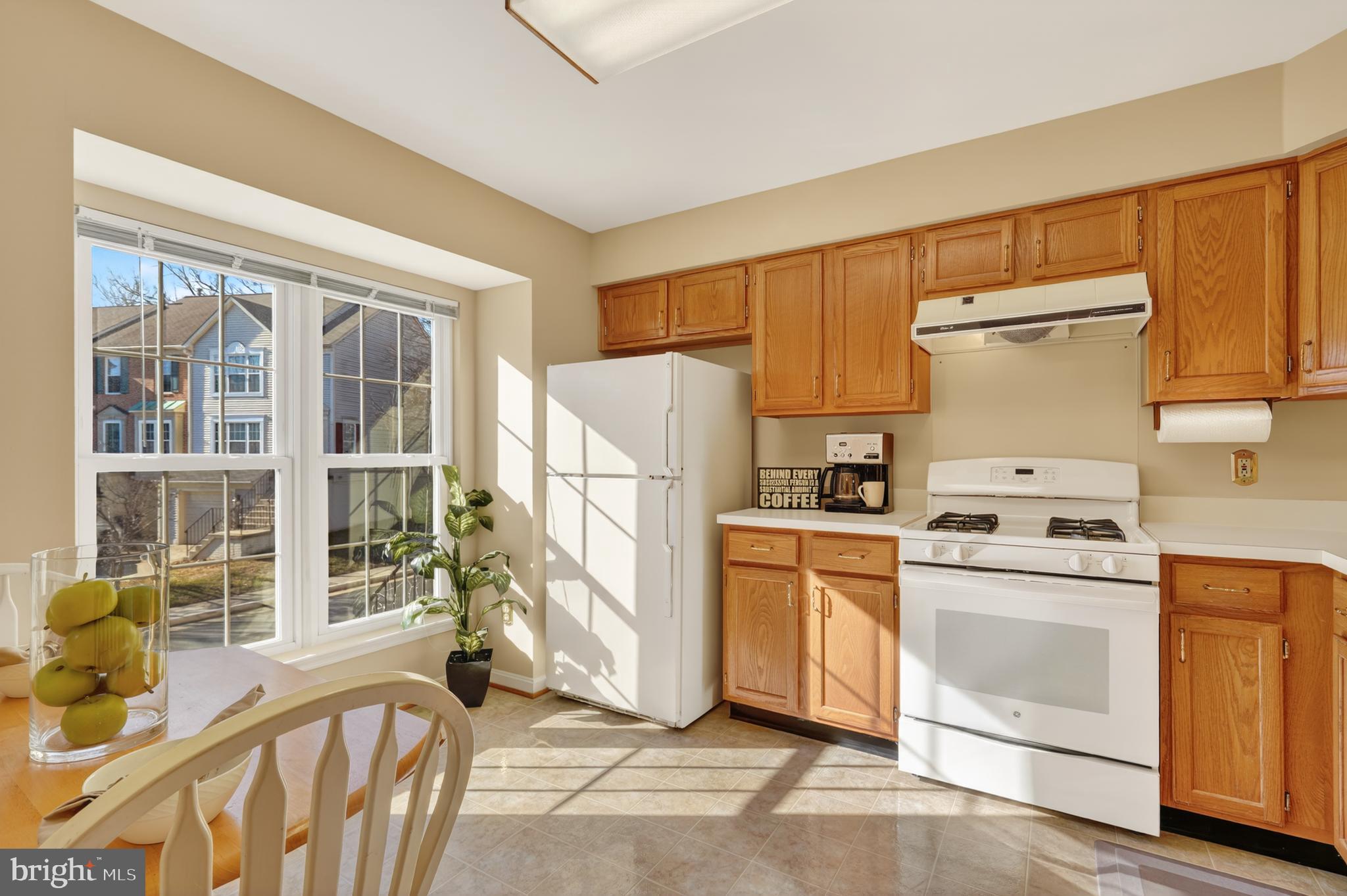 45590 Whitcomb Square Sterling, VA 20166 - Photo 2 of 43 a kitchen with granite countertop a stove a sink and a refrigerator