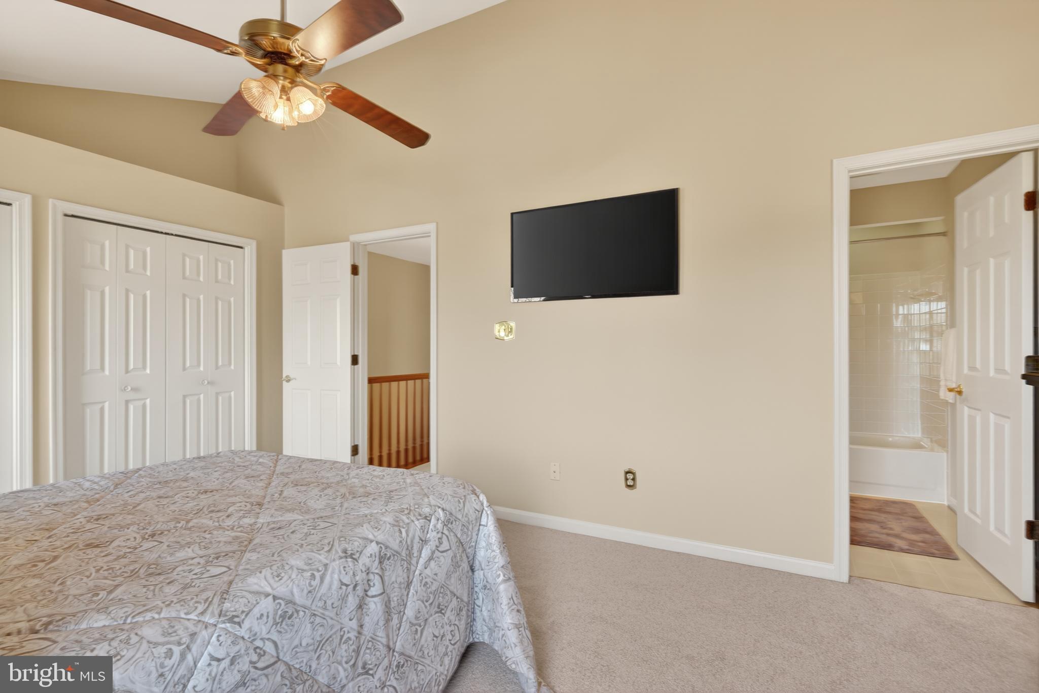 45590 Whitcomb Square Sterling, VA 20166 - Photo 23 of 43 a bedroom with a bed and a chandelier