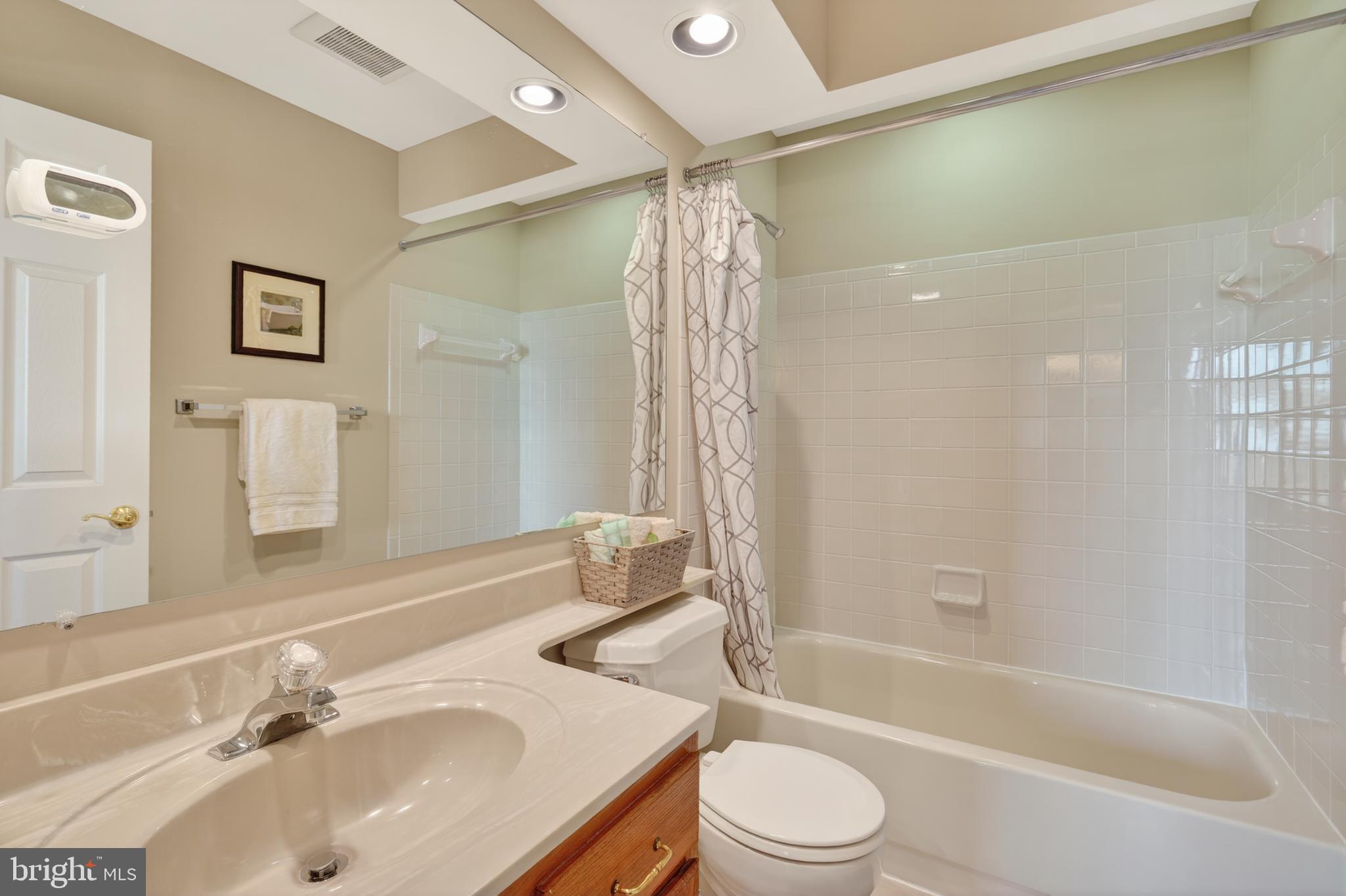 45590 Whitcomb Square Sterling, VA 20166 - Photo 24 of 43 a bathroom with a sink toilet and shower