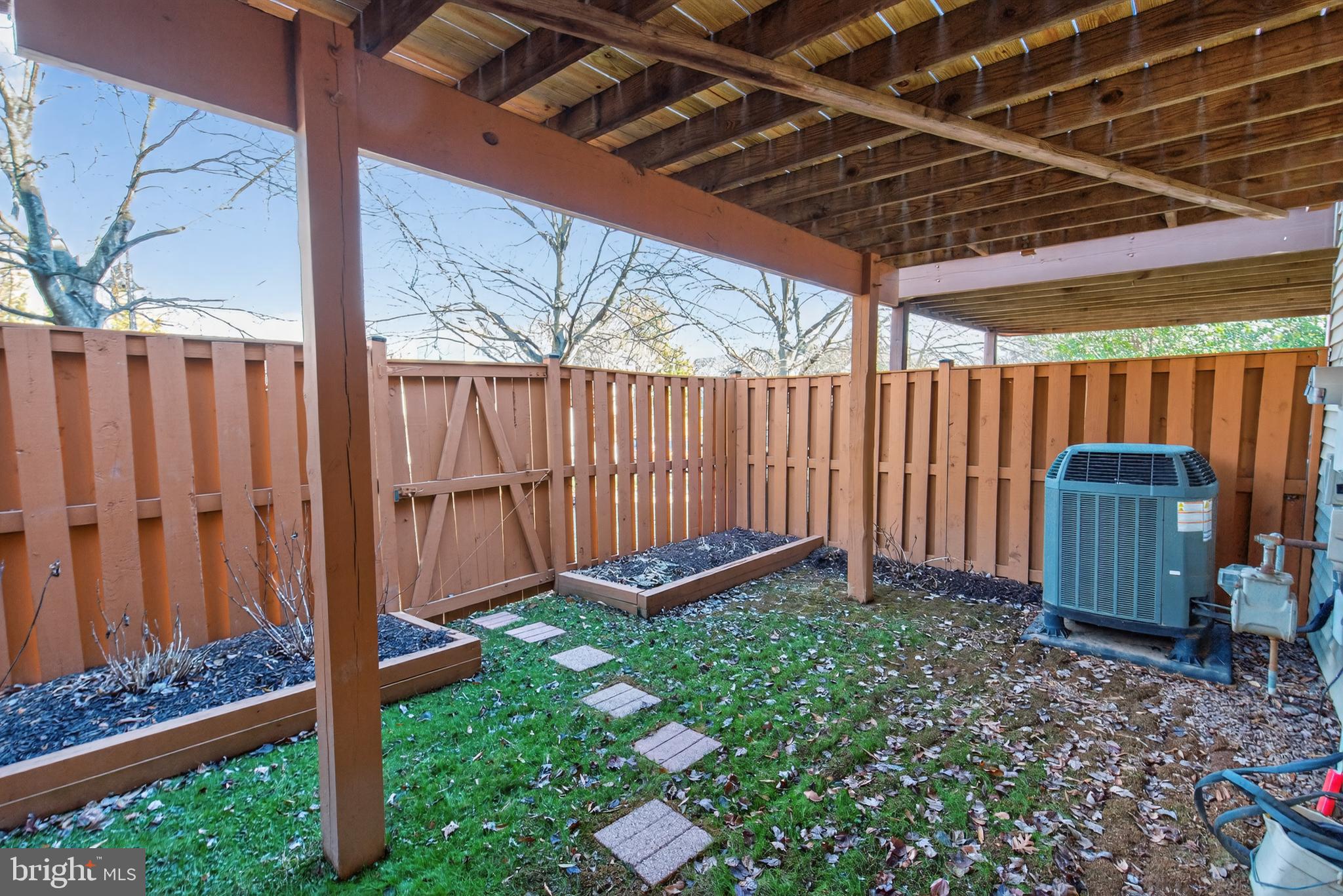 45590 Whitcomb Square Sterling, VA 20166 - Photo 31 of 43 a view of a backyard with wooden fence