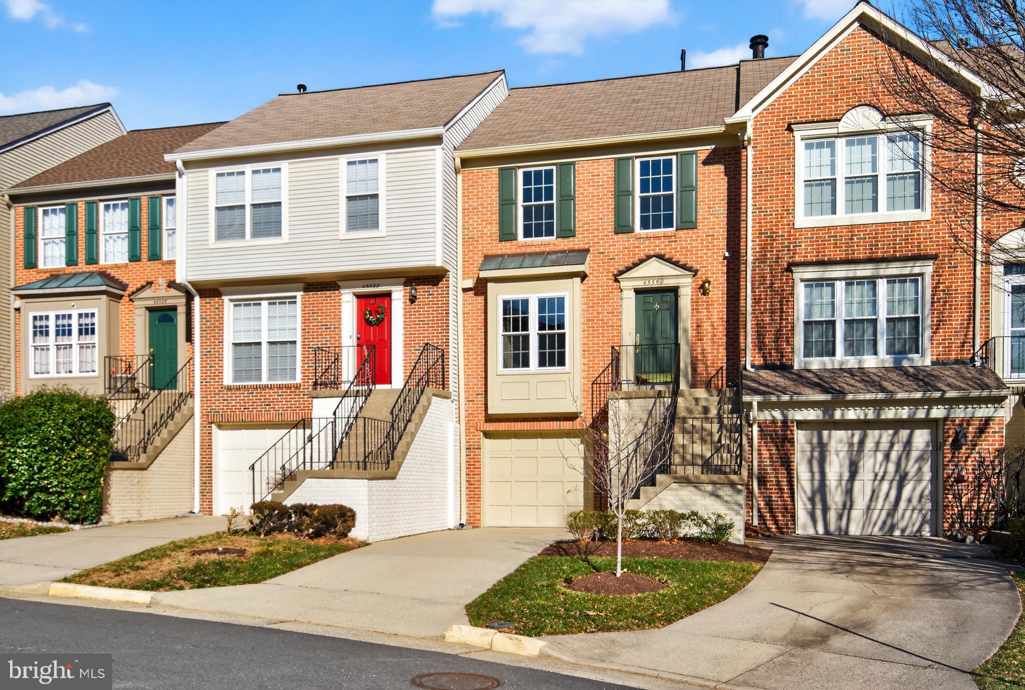 45590 Whitcomb Square Sterling, VA 20166 - Photo 36 of 43 a front view of a house with a porch