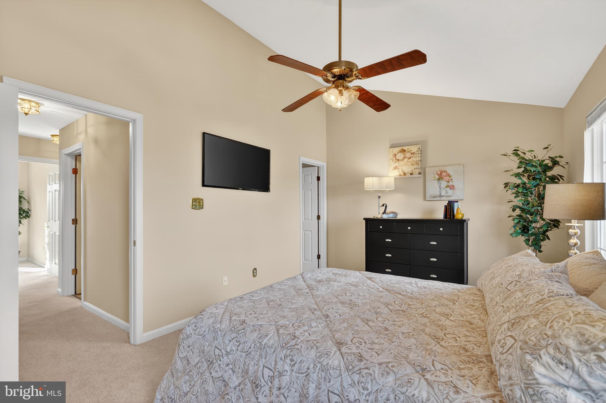 45590 Whitcomb Square Sterling, VA 20166 - Photo 5 of 43 a bedroom with a bed and a chandelier
