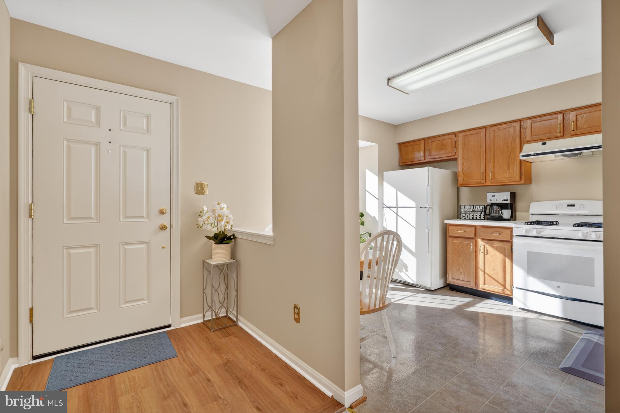 45590 Whitcomb Square Sterling, VA 20166 - Photo 7 of 43 a view of a kitchen with refrigerator and dishwasher