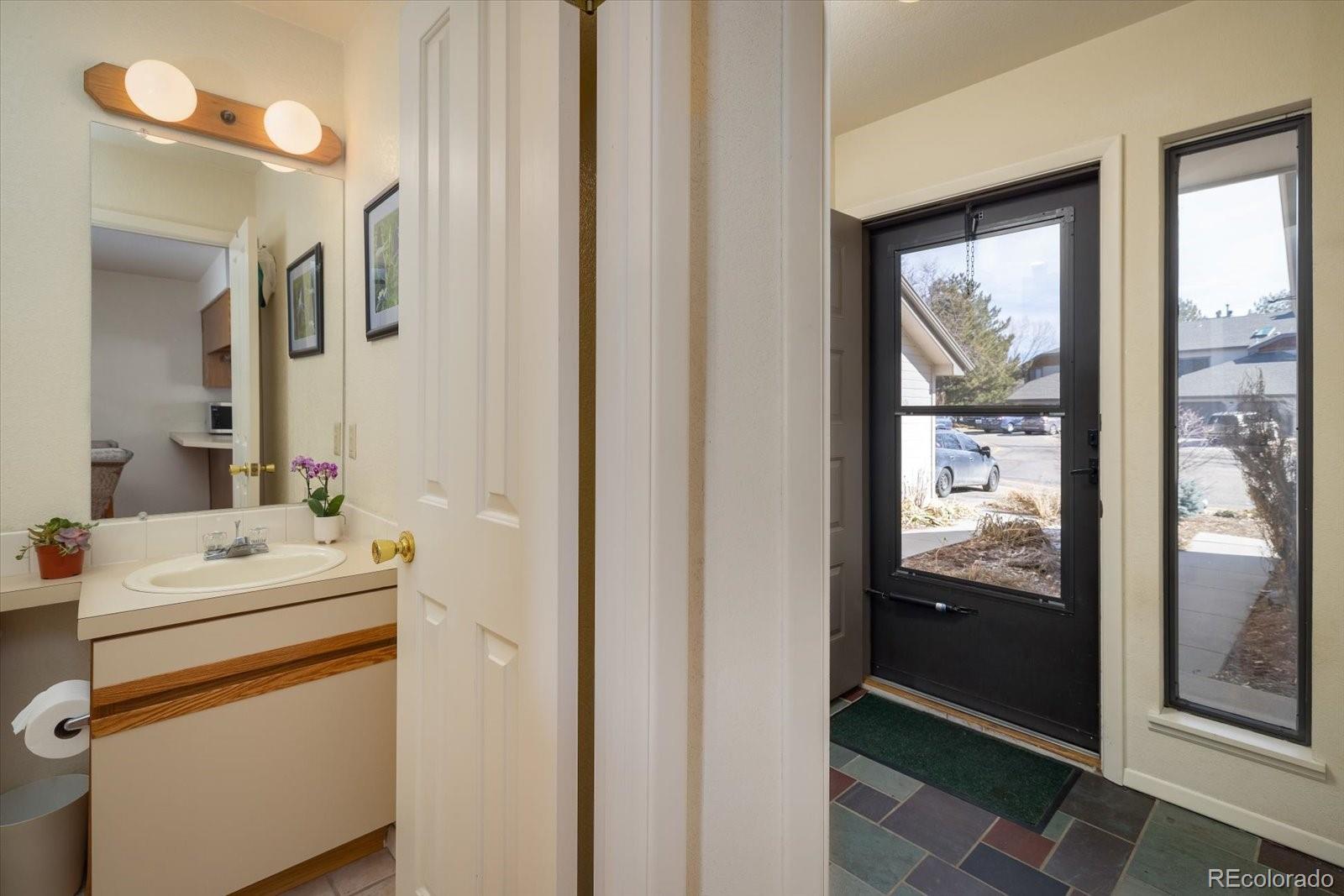 4635 Chestnut Lane, Unit 3 Boulder, CO 80301 - Photo 11 of 36 a bathroom with a sink a toilet and a mirror