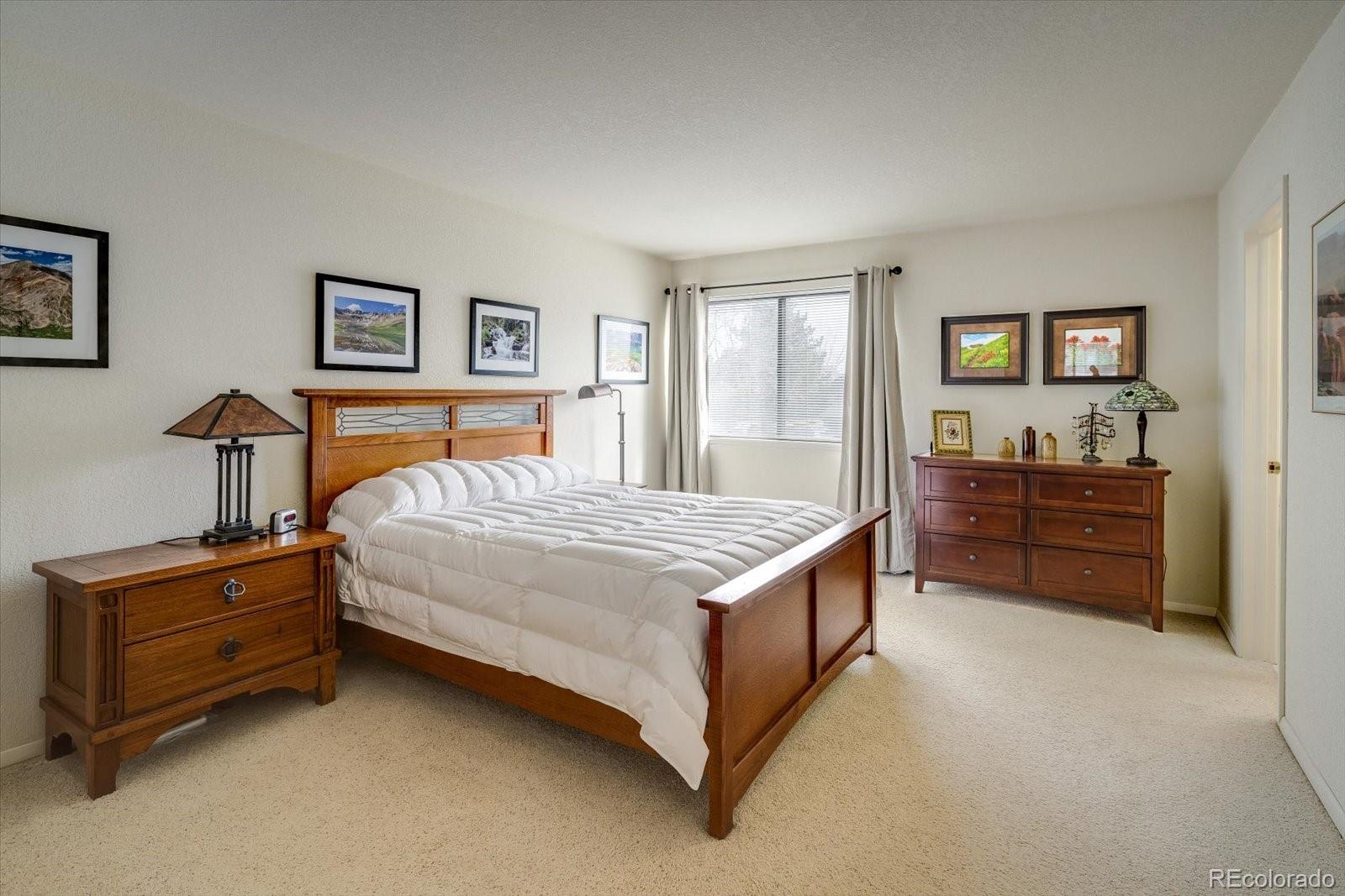 4635 Chestnut Lane, Unit 3 Boulder, CO 80301 - Photo 12 of 36 a bed room with a bed and a dresser