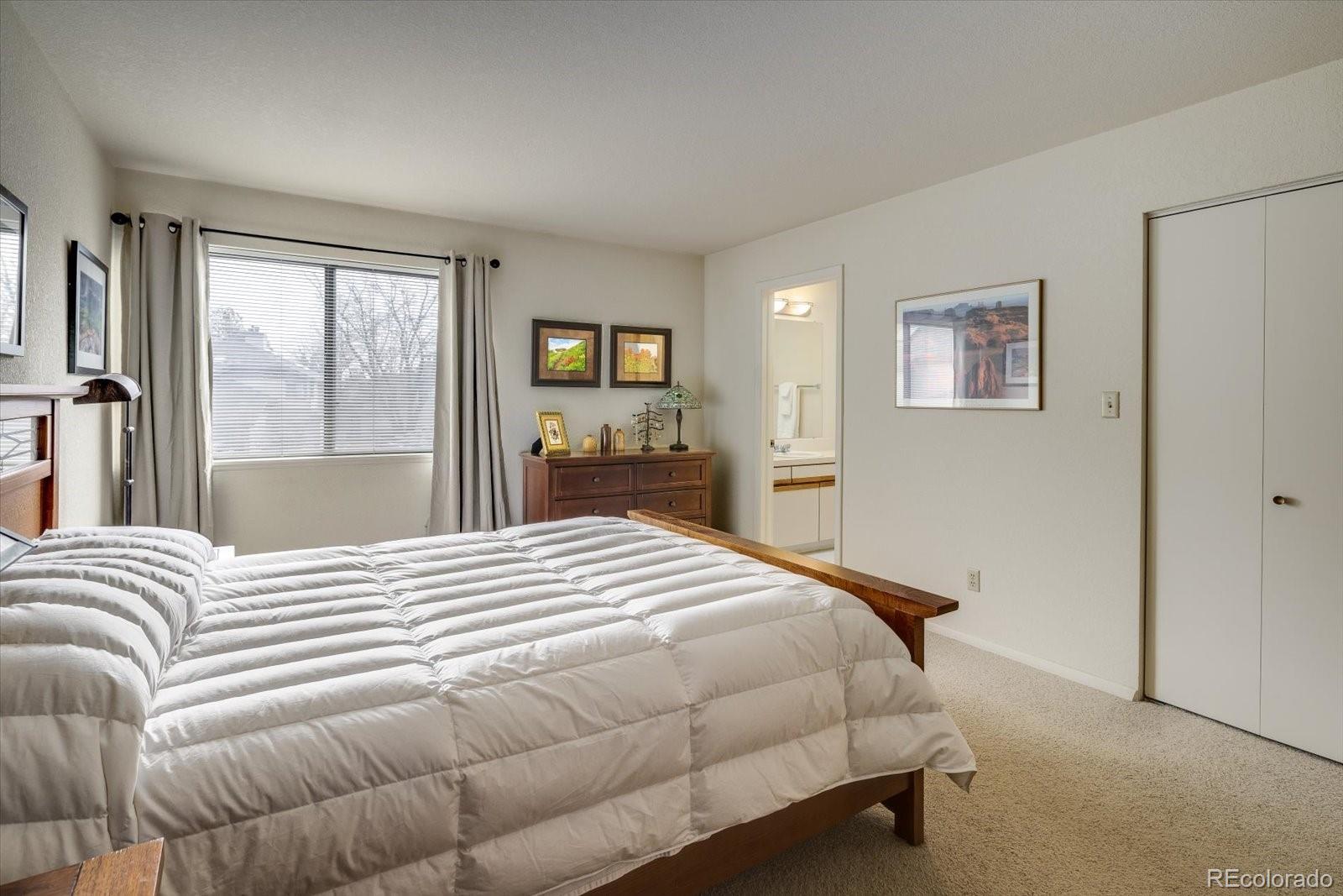 4635 Chestnut Lane, Unit 3 Boulder, CO 80301 - Photo 13 of 36 a bedroom with a bed and a dresser
